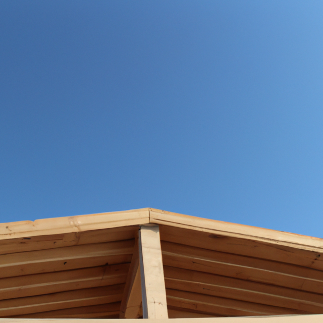 DALL·E 2023-07-12 13.13.12 - photo d'une charpente en bois moderne avec le ciel bleu en fond et que l'on voit toute la charpente sur le toit de la maison
